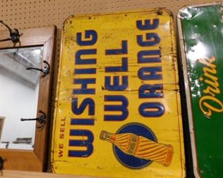 Wishing well orange beverage metal sign