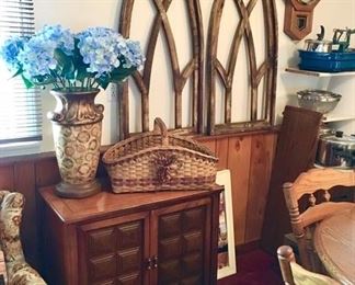Vintage sewing machine cabinet, vintage cathedral window frames are SOLD, vase w/ silk flowers, baskets