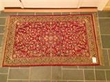 Lot 75
Machine Made. Persian Style Rug

Red background, greenish gray and tan pattern. 61X34 including fringe