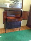 Lot 16
Gentleman's Chest, 3 drawers behind doors on top 

36x20x48 (WxDxH) three drawers I on chest, two pull out drawers, dark wood, good condition, some marks and scrapes