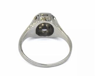 PLL #733 Antique Art Deco diamond ring featuring an ~.07 carat Old European cut diamond in an Art Deco millwork and filigree mounting crafted of 18k white gold. The size 5.25 ring is marked "18K" inside the shank.
Metal: 18k white goldWeight: 3.4 grams
Diamond: Cut: Old European
Carat: ~.07ct Size: 5.25 Condition: Metal has light scratches and scuffs. Diamond is well set and free from chips with no visible abrasions. $120