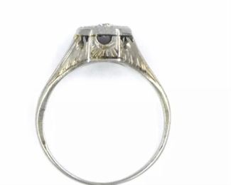 PLL #733 Antique Art Deco diamond ring featuring an ~.07 carat Old European cut diamond in an Art Deco millwork and filigree mounting crafted of 18k white gold. The size 5.25 ring is marked "18K" inside the shank.
Metal: 18k white goldWeight: 3.4 grams
Diamond: Cut: Old European
Carat: ~.07ct Size: 5.25 Condition: Metal has light scratches and scuffs. Diamond is well set and free from chips with no visible abrasions. $120