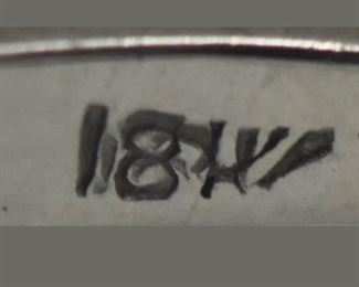 PLL #733 Antique Art Deco diamond ring featuring an ~.07 carat Old European cut diamond in an Art Deco millwork and filigree mounting crafted of 18k white gold. The size 5.25 ring is marked "18K" inside the shank.
Metal: 18k white goldWeight: 3.4 grams
Diamond: Cut: Old European
Carat: ~.07ct Size: 5.25 Condition: Metal has light scratches and scuffs. Diamond is well set and free from chips with no visible abrasions. $120