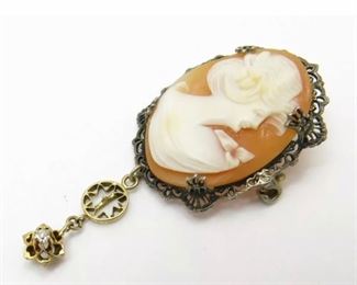 Vintage Sterling Silver Cameo Pin w/ 10k Yellow Gold Diamond Accent Dangle
Weighs 2.45dwt measures 2 inches long dangle and 7/8 inches across Diamond accent measures 2mm across. In good condition