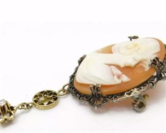 Vintage Sterling Silver Cameo Pin w/ 10k Yellow Gold Diamond Accent Dangle
Weighs 2.45dwt measures 2 inches long dangle and 7/8 inches across Diamond accent measures 2mm across. In good condition