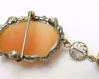 Vintage Sterling Silver Cameo Pin w/ 10k Yellow Gold Diamond Accent Dangle
Weighs 2.45dwt measures 2 inches long dangle and 7/8 inches across Diamond accent measures 2mm across. In good condition