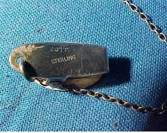 vintage sterling silver baby bib clips from the early 20thc..features ornate designs and is all in very good condition with no damages or excessive wear-its complete with chain and is signed sterling..