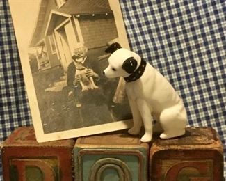 Original set of old wooden Troy ABC blocks that spell out DOG and has illustrations of animals. Also included is an antique RCA Nipper dog figurine and early 1900s photo real snapshot of a man and his dog.