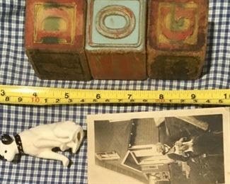 Original set of old wooden Troy ABC blocks that spell out DOG and has illustrations of animals. Also included is an antique RCA Nipper dog figurine and early 1900s photo real snapshot of a man and his dog.
