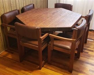 Solid Wood Hexagon Table (46 in. x 46 in. x 30 in.) and 6 Brown Vinyl Upholstered Chairs (19 in. seat) ~ one has damage ~ see last picture