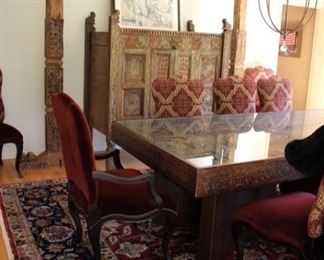 Indonesian heavily carved door made into a dining table
	Measures 106”l x 4’w x 30 ½” h – top & base can be 	separated for ease of moving. It also can be a door 	again if preferred.
