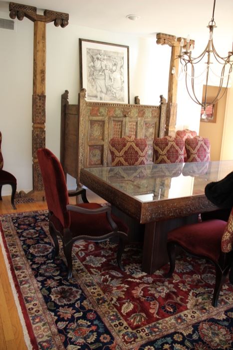 Indonesian heavily carved door made into a dining table
	Measures 106”l x 4’w x 30 ½” h – top & base can be 	separated for ease of moving. It also can be a door 	again if preferred.
