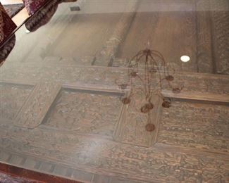 Indonesian heavily carved door made into a dining table
	Measures 106”l x 4’w x 30 ½” h – top & base can be 	separated for ease of moving. It also can be a door 	again if preferred.
