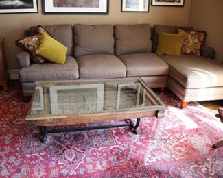Vanguard 2 piece chaise sectional
Carved Balinese door cocktail table