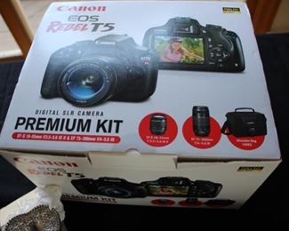 Canon EOS Rebel T5 camera  (new in box, never opened)
