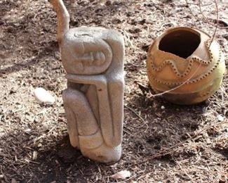 Carved stone garden figure