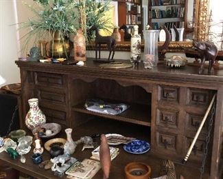 Antique desk with many collectibles 