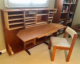 Inside the box a desk with a built in extendable lamp
Also Danish chair
