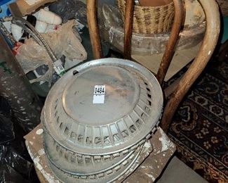 Lot #484 - 4 Hubcaps and Vintage Metal Chair - $25