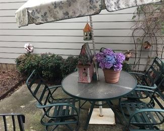 Patio table with umbrella and four chairs
