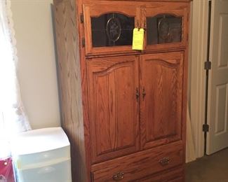 Beautiful petite entertainment center with storage drawers and knickknack cupboard