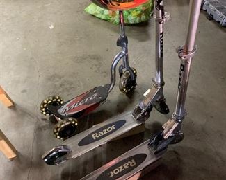 Razor scooters with helmets and pads. 3 sizes. Tiny. Pretty Tiny, darn tiny. 