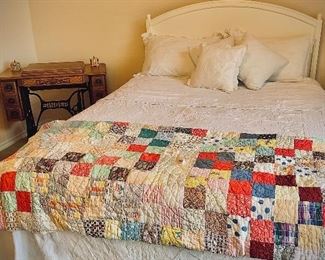 beautiful handmade quilts, and a darling antique full bed-head and curved/rounded footboard