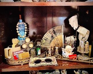 THIS. Y'ALL.  ANYONE WHO LOVES OLD, ADMIRES VINTAGE, WHISTLES AT PIN-UPS, OR KNOWS WHO JACKIE O. IS.. THIS IS HOW IT HAPPENED. LIPSTICK CAROSOUL, HAND GLOVE DISPLAY, HAND FANS, EYE GLASSES, PERFUME BOTTLES. YOU'VE GOT TO SEE THIS 