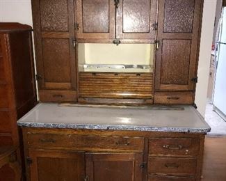 McDougall Hoosier cabinet $400.00  (pick up only) the roll door in the middle is detached. Please see photos for condition. 