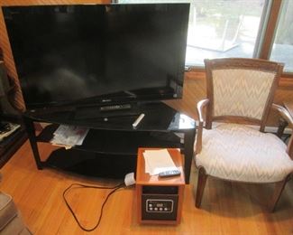 TV  Stand $50. (tv & heater sold) CHAIR $85.