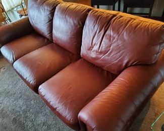 5 Pieces of well cared for leather furniture with nail head trim. Includes sofa, two chairs and two matching ottomans! SMOKE & PET FREE HOME:)