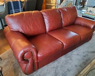 5 Pieces of well cared for leather furniture with nail head trim. Includes sofa, two chairs and two matching ottomans! SMOKE & PET FREE HOME:)