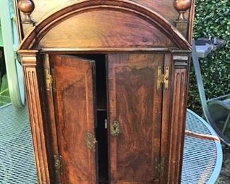 19th c flame mahogany cabinet with lift up top and secret pullouts (pillasters on both left and right) $150.00