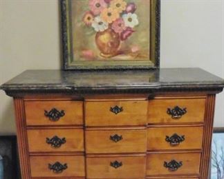 Four drawer marble topped dresser; floral oil painting