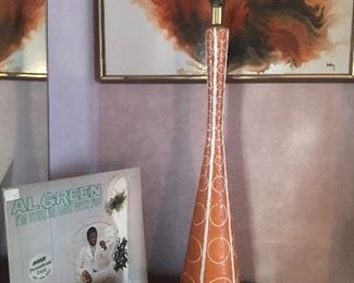 There is a pair of these tall pottery 1950's mod lamps
