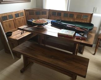 This is a neat piece!  This dining table with bench seats is perfect for a smaller area or nook.  The bench seats on the wall each lift up for storage!