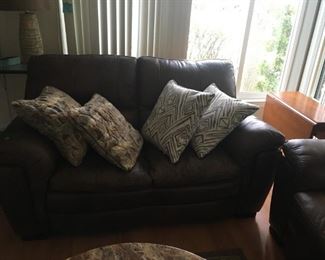 (sorry for the darkness)  This is a matching brown leather love seat -- again, pillows sold separately.
