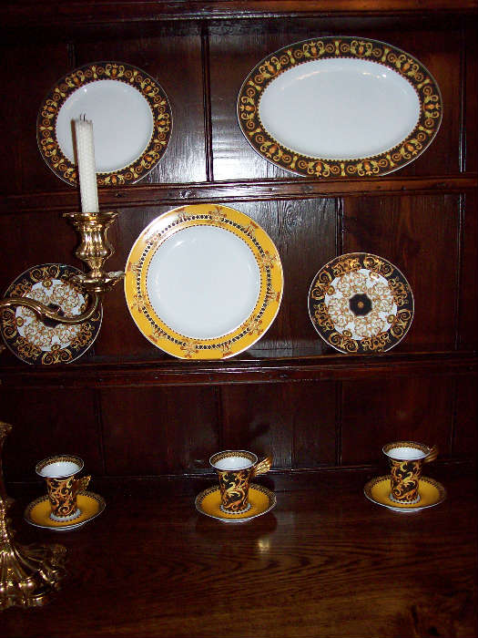 Versace Barocoo china service. There are 6 - 5 pc place settings and two platters.