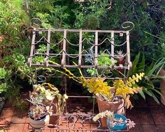 Wrought iron book stand with shelf