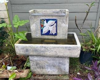 Concrete Scandinavian style water fountain with tile bird