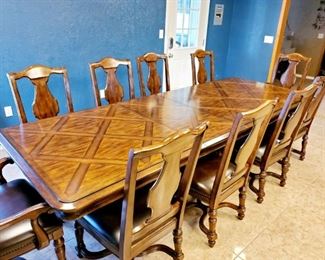 12 chair dining room table ( 2 chairs not present)