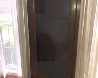 This is a mid century gun cabinet.  We have had a hard time getting an acceptable photo due to lighting. 