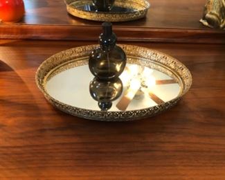 monkey bottle on mirrored tray 