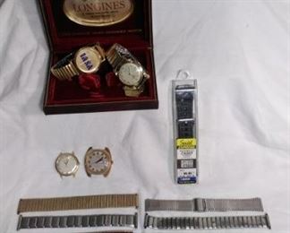collection of watches and watch bands