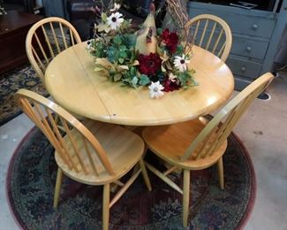 Just the right sized round pine breakfast table and four chairs