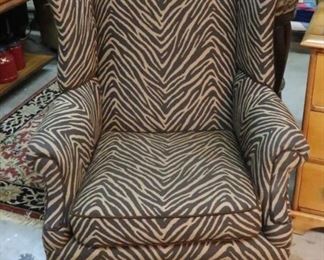 Brown zebra upholstered arm chair