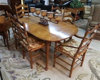 Thomasville maple dining table, six chairs with rush seats, leaves and pads.  Can be paired with the red and gold upholstered chairs.