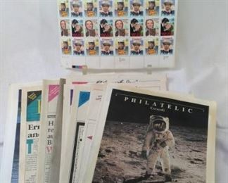 Philatelic catalogs and full sheet of stamps
