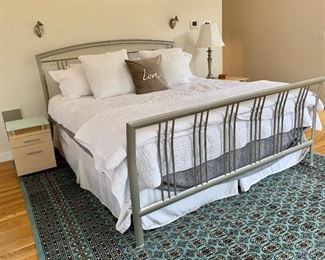Sturdy Metal Queen bed and large blue and black Bokhara (linens not for sale)