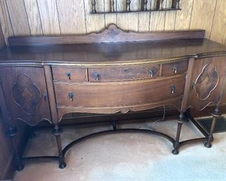 This lovely buffet is over 100 years old. It is 72” long, 23” deep, and 38” high. The veneered surface is in excellent condition.